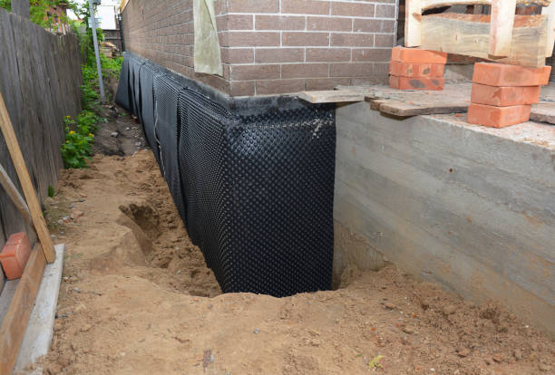 SJ Waterproofing Pros technician performing targeted Exterior Waterproofing assessment in Madison, OH